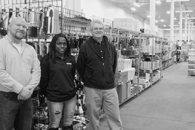 restaurant-company Rapids Restaurant Equipment assistant manager Blake Skaja, sales associate Irina Johnson and general manager Harold Parten.
