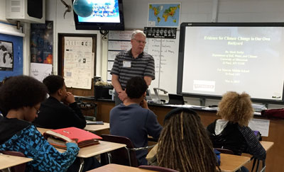 Dr. Mark Seeley talks with students about climate change.