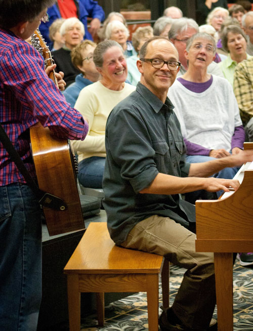 Ann Reed, left, and Dan Chouinard lead the monthly St. Anthony Park community sing held on the Luther Seminary campus. Photo by Lori Hamilton