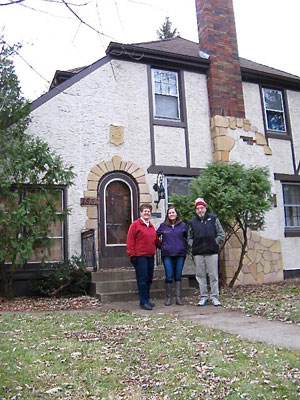 Neighborhood residents, left to right, Judy Bailey, Briana Vogen and Roger Aiken shown in front of the one-time model home, now owned by Vogen.