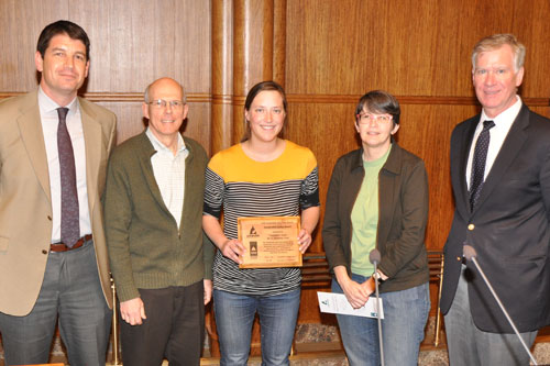St. Paul City Council president Russ Stark (left) and Mayor Chris Coleman (right) present the Sustainable Living Award to Transition Town-ASAP members Tim Wulling, Allie Rykken and Pat Thompson at a ceremony on April 20.