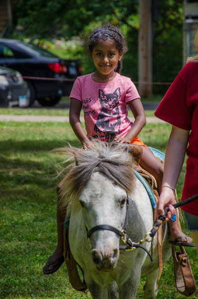 Mereti Burbach of St. Anthony Park gets a pony ride at Langford Park. Photo courtesy of St. Paul Parks and Recreation