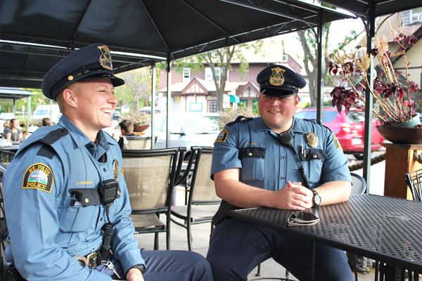 St. Paul police officers Shannon Diedrich and Randy Axtell take time to chat outside the Finnish Bistro recently. Photo by Kristal Leebrick